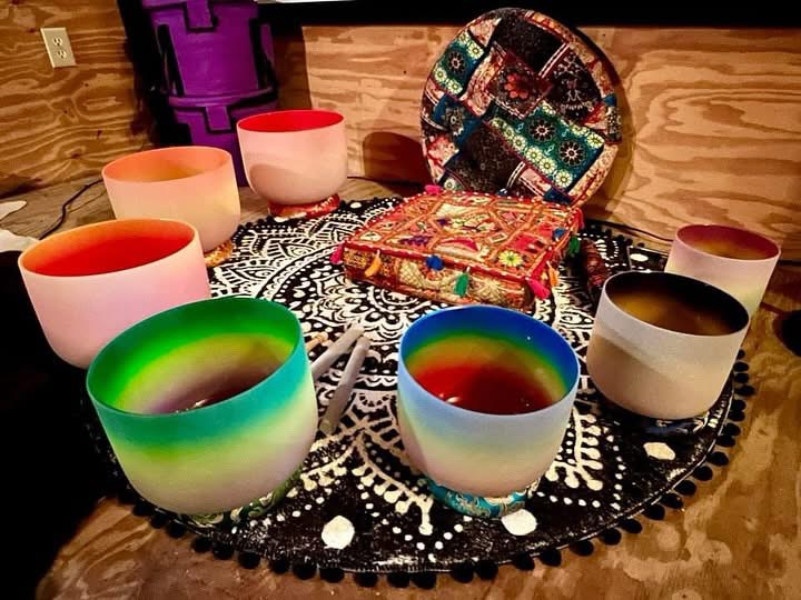 Crystal singing bowls set out before a sound bath